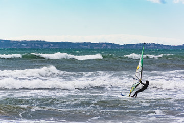 Active kite surfer in the Mediterranean Sea of Majorca Island