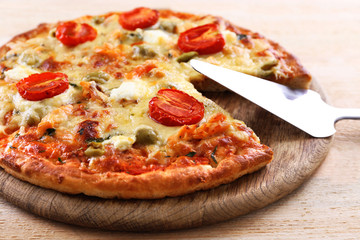 Delicious tasty pizza with shovel, closeup