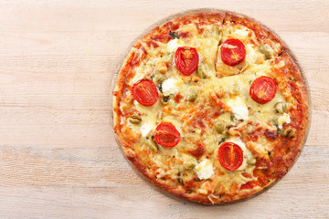 Delicious tasty pizza on wooden table