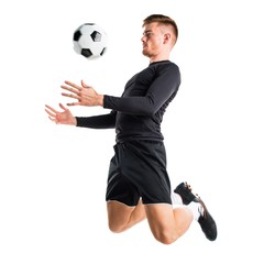 Young blonde man playing football