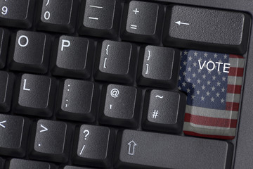 An American flagged VOTE key on a computer keyboard