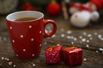 Close up of tea cup with christmas decoration on wooden table