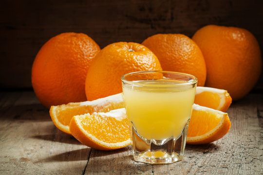 Orange juice in a large glass, selective focus