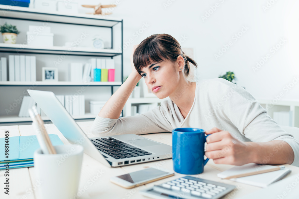 Poster tired woman at office desk