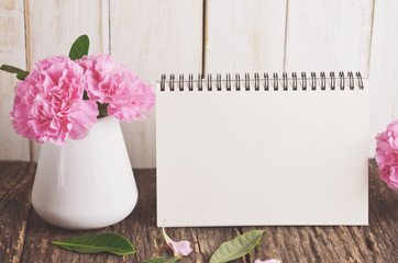 Blank Desk calendar with pink carnation flower