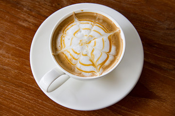 Closeup, Hot Caramel Macchiato in white coffee cup