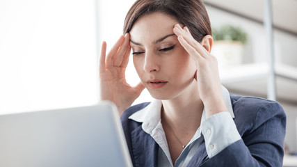 Exhausted businesswoman at work