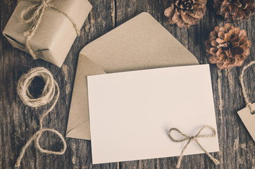 Blank white paper card with brown envelop