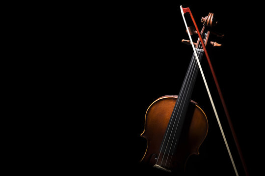 Old ,retro violin on the black background.