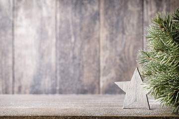 Christmas fir branch and decor, on the wooden background.