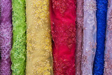 pile of colorful lace fabric