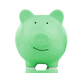 Green ceramic piggy bank isolated on white
