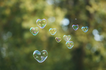 Soap bubbles in heart shape outdoor