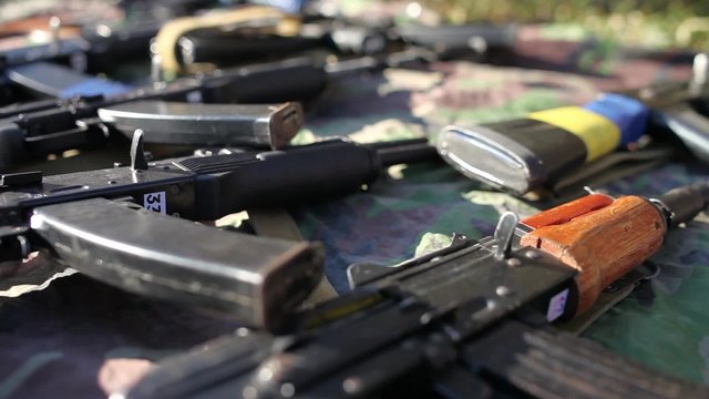 paintball guns lying on the ground