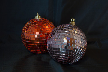 Glittering Christmas balls against a black background