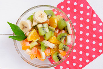 Fruit salad on wooden background