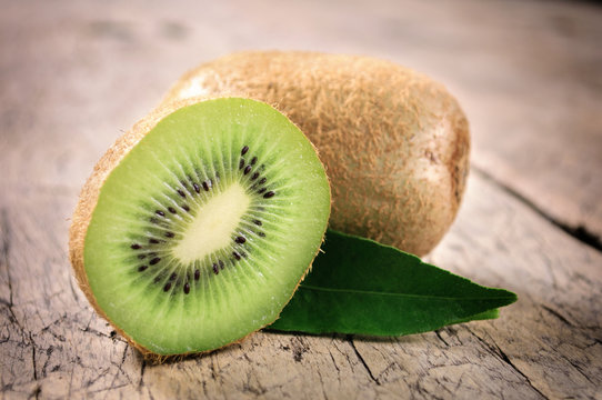 Kiwi fruit on brown wooden background