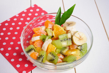 Fruit salad on wooden background