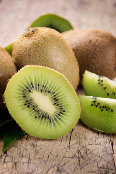 Kiwi fruit on brown wooden background