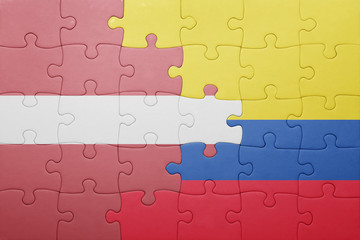 Fototapeta premium puzzle with the national flag of colombia and latvia