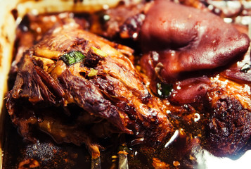 Pork leg with gravy sauce at market