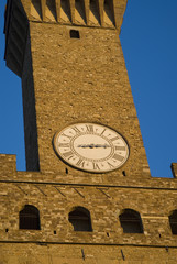 Fototapeta na wymiar Florence, Italy. Tower of Palazzo Vecchio in evening light, close-up