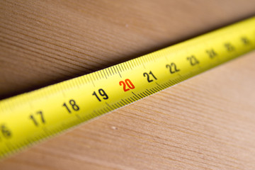 Measuring tape on wood