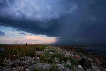 Storm clouds coming in from the sea to the shore