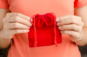 Red bag hold by hand to giving on Chinese new year