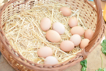 Chicken eggs on a straw bazaar counter