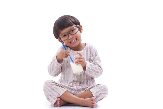 Little boy with a glass of milk