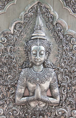 Fototapeta na wymiar Thai style silver carving art on temple wall