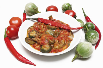 Eggplants mini, tomatoes and peppers, cooking