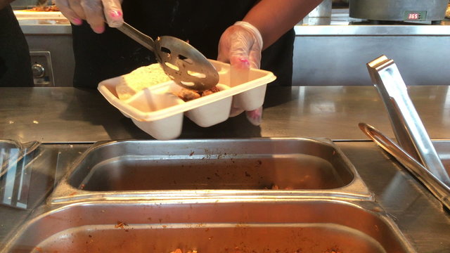 Hard shell taco prepared at food restaurant.