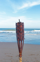 flaming torch on the beach