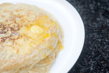 Russian traditional pancake with piece of butter