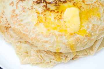 Russian traditional pancake with piece of butter