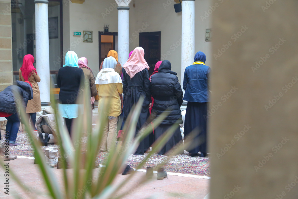 Wall mural Prayer performing by muslim women