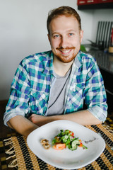 Young man cooking in home kitchen