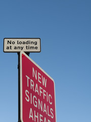 No loading traffic road sign against a clear blue sky