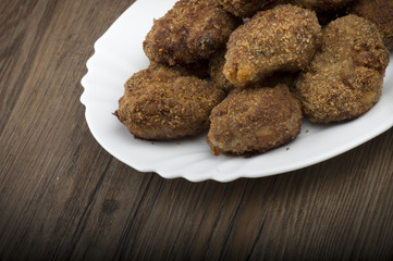 plate of meatballs on the wooden table