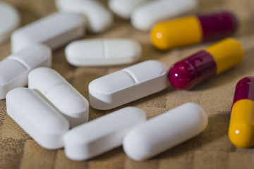painkiller pills on a textured background