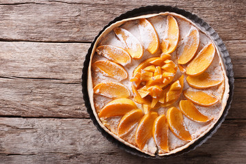 Tart with persimmon and cream cheese. Horizontal top view

