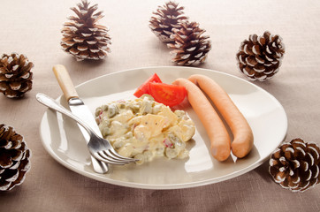 potato salad on a plate with pine cone