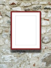 Close-up of one red picture frame on stone wall background