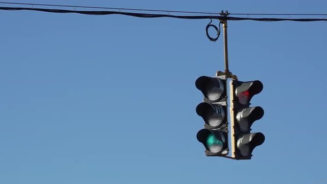 Traffic light hangs over a typical  U.S. roadway.
