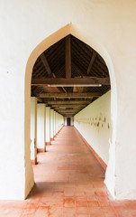 Old white gate, Walking entry way at Pha That Luang in Vientiane Laos.