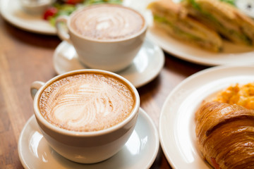 Breakfast with coffee and croissants