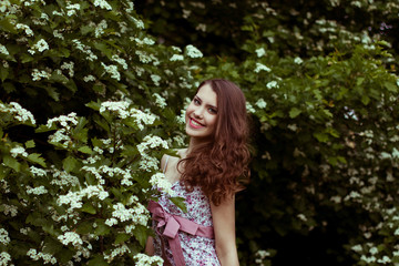 Naklejka premium Beautiful woman in the garden