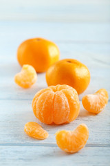 Ripe mandarins on a blue wooden table